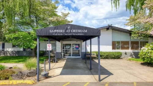 A covered entrance with a sign that reads Sapphire at Gresham Post Acute Care and Rehabilitation